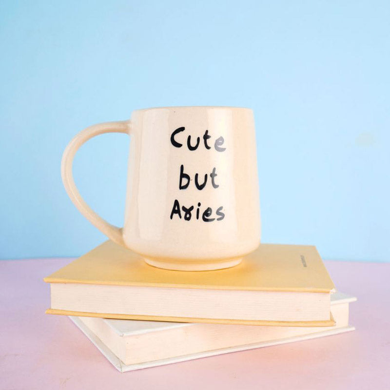 Buy Cute But Aries Cup - 250 ML Mug & Tea Cup from Vaaree