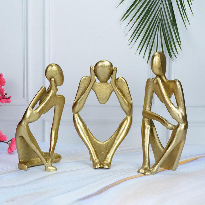 Buy Human Ponder Showpiece (Gold) - Set Of Three Showpieces from Vaaree