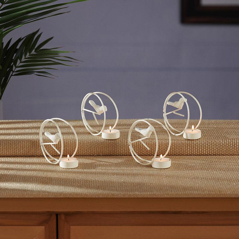 Buy Alaiza Chirp Tealight Candle Holder (White) - Set Of Four Tea Light Candle Holders from Vaaree