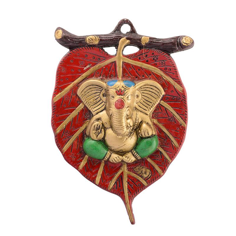 Buy Balganesha Resting on Leaf Religious Wall Accent - Red & Gold Wall Accents from Vaaree