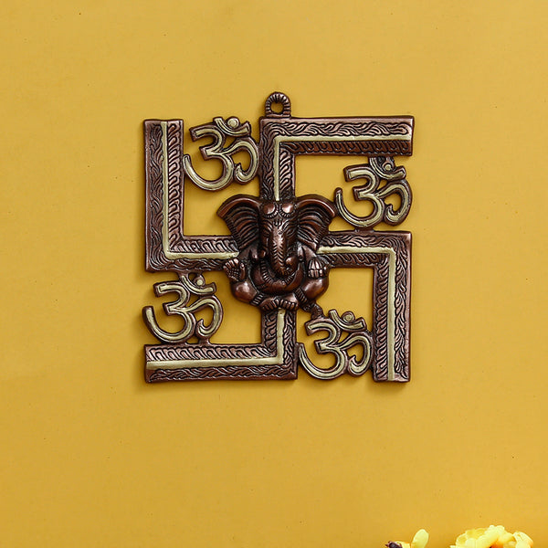 Buy Swastika Om Metal Religious Wall Accent - Golden Brown Wall Accents from Vaaree