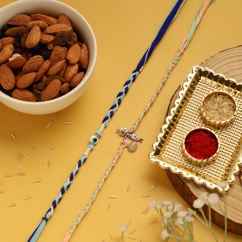 Buy Nadora Krishna & Evil Eye Rakhi Hamper Rakhi from Vaaree