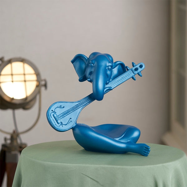 Buy Ganesha Sitar Showpiece - Blue Showpieces from Vaaree