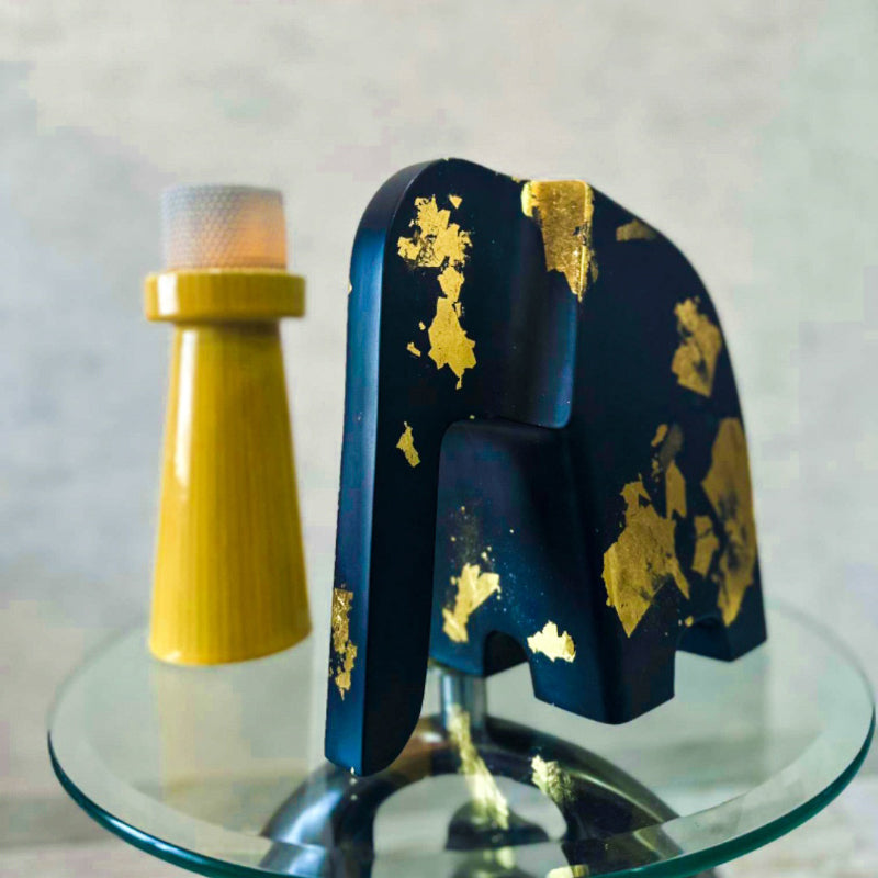 Buy Symmetrical Tusker Showpiece - Black & Gold Showpieces from Vaaree