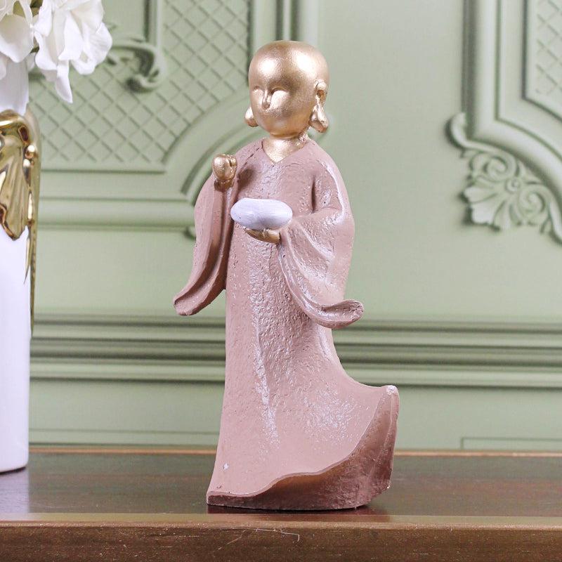 Buy Ethereal Little Monk Showpiece - Gold & Pink Showpieces from Vaaree