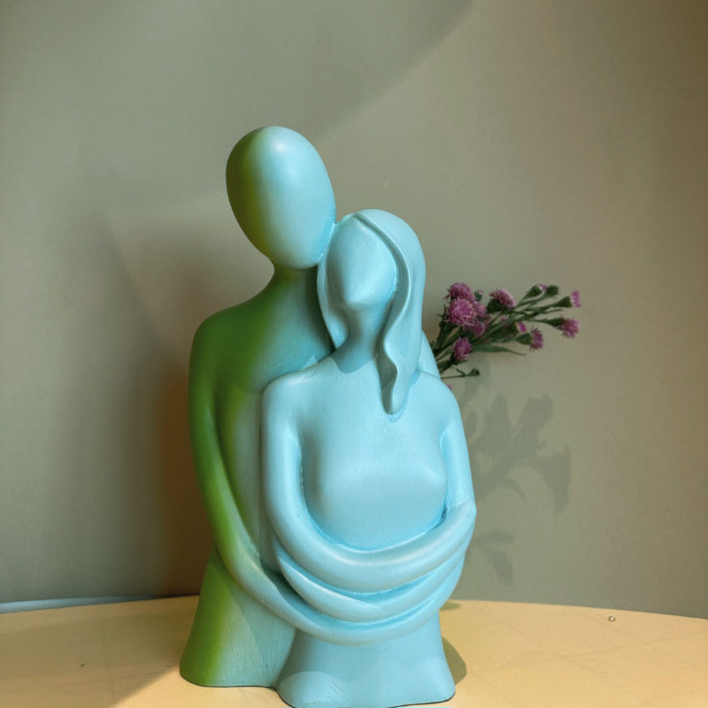 Buy Love Cuddle Showpiece - Blue Showpieces from Vaaree