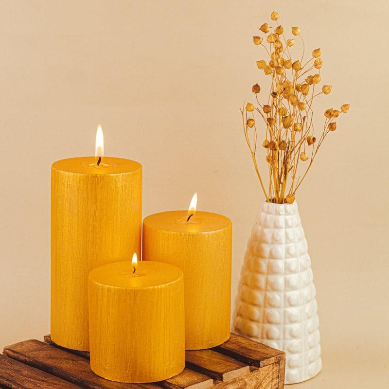 Buy Dorado Unscented Pillar Candle (Gold) - Set Of Three Candles from Vaaree