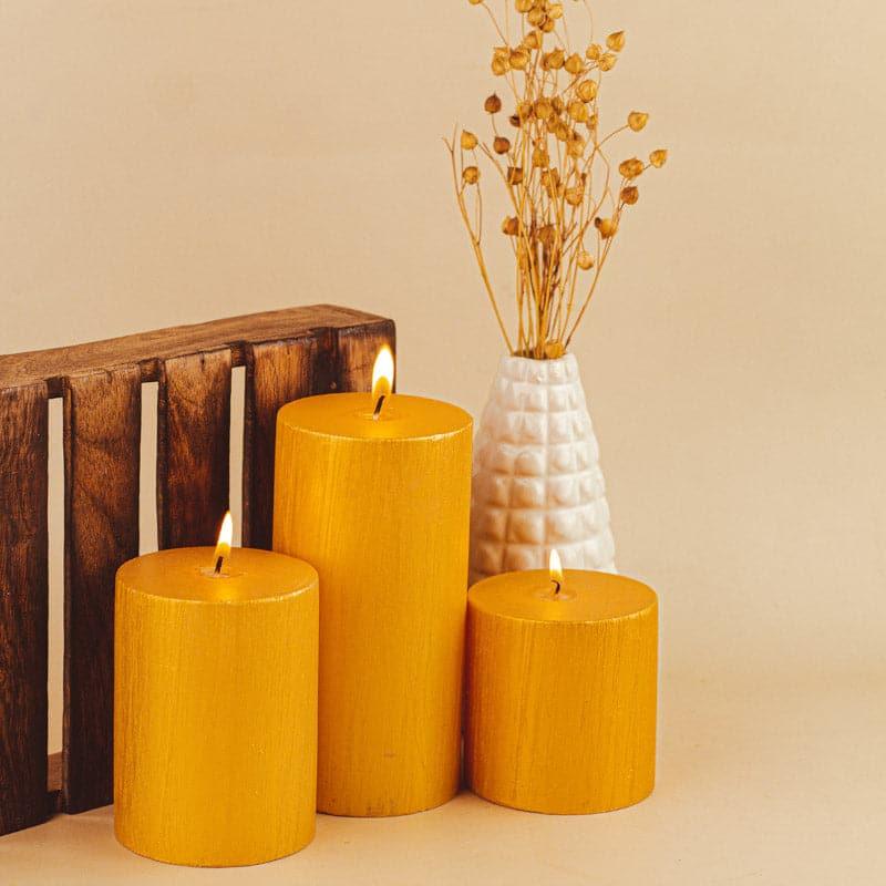 Buy Dorado Unscented Pillar Candle (Gold) - Set Of Three Candles from Vaaree