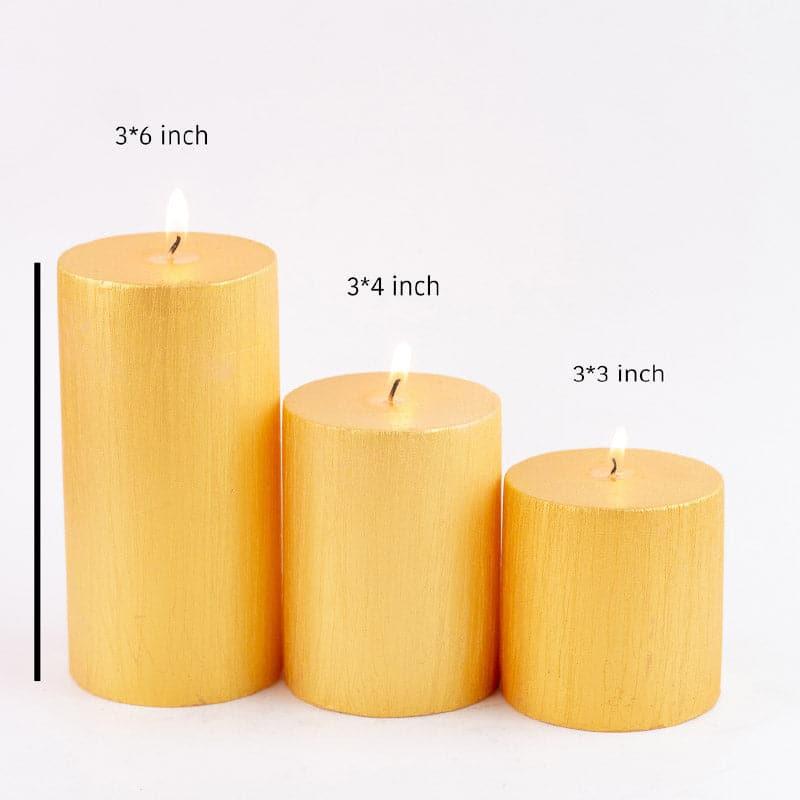 Buy Dorado Unscented Pillar Candle (Gold) - Set Of Three Candles from Vaaree