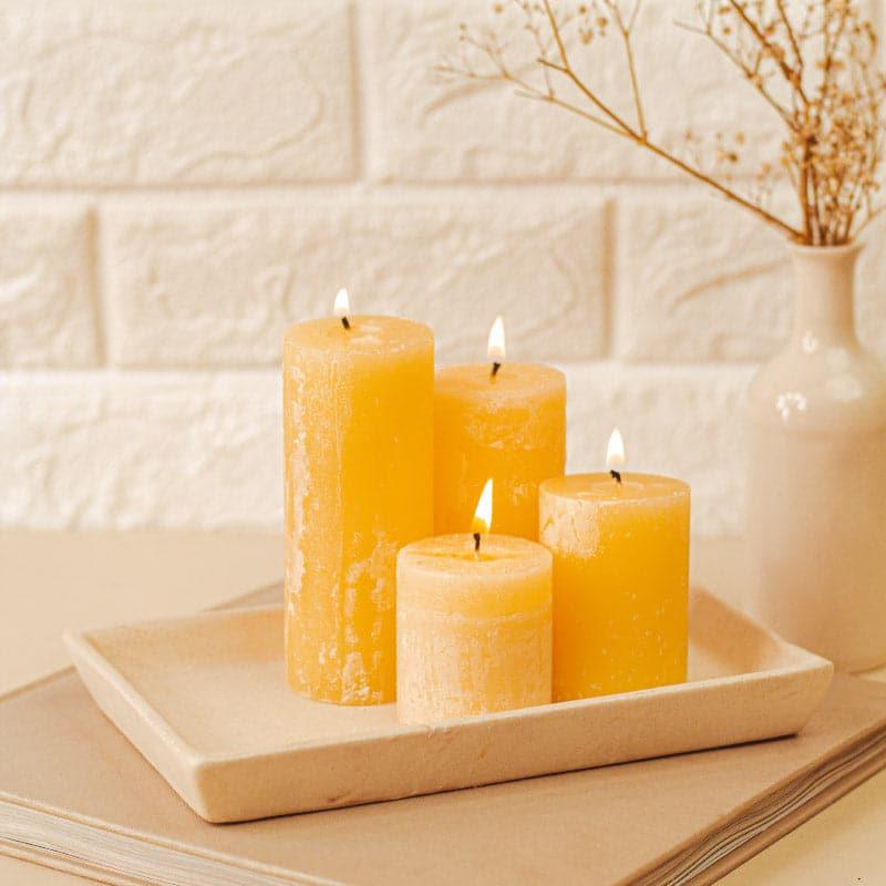 Buy Zora Vanilla Scented Pillar Candle - Set Of Four Candles from Vaaree