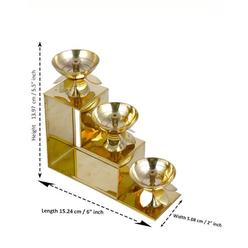 Buy Brass Kamal Step Diya Diyas from Vaaree