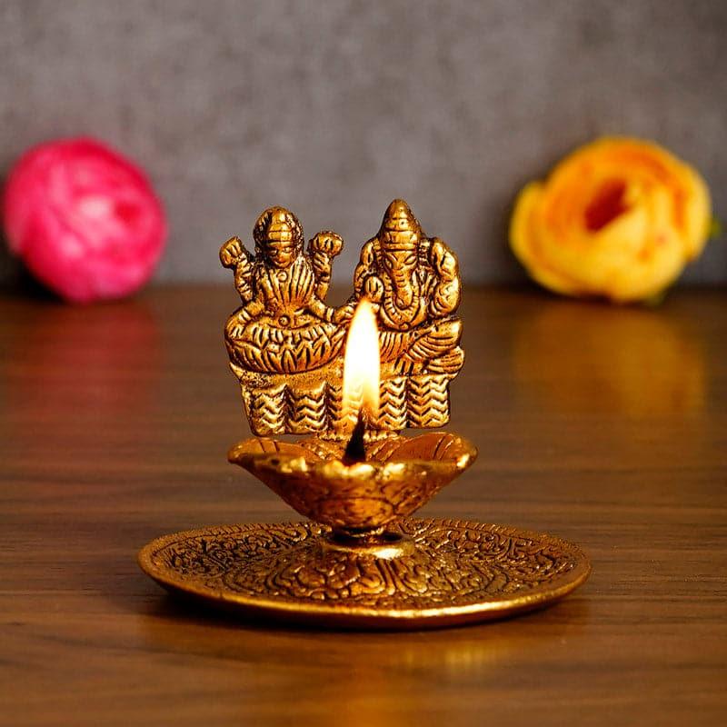 Buy Ganesha & Lakshmi Metal Diya Diyas from Vaaree