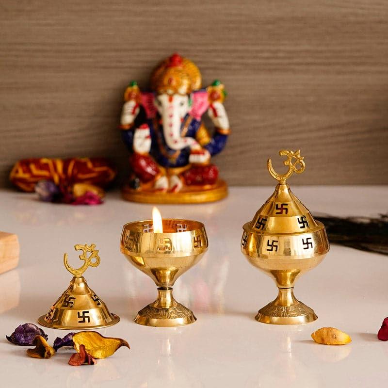 Buy Om Swastik Brass Diya - Set Of Two Diyas from Vaaree