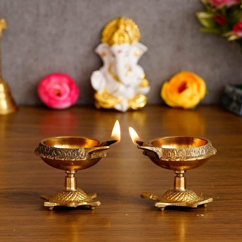 Buy Tortoise Brass Diya - Set Of Two Diyas from Vaaree