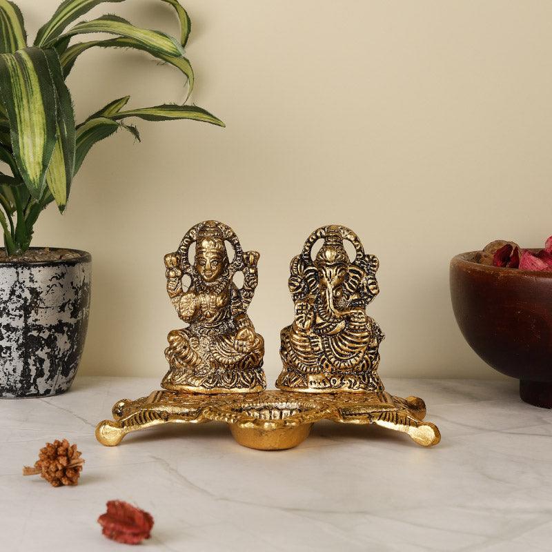 Buy Divine Laxmi Lambodara Idol Idols & Sets from Vaaree