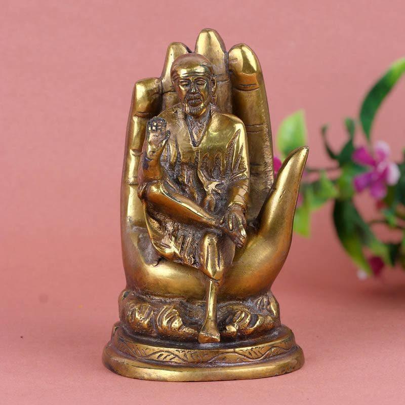 Buy Shiridhi Saibaba On Palm Brass Idol Idols & Sets from Vaaree