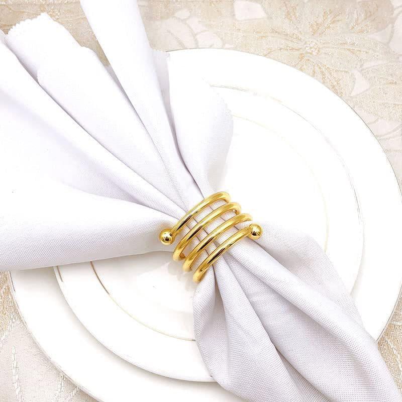 Buy Spiral Swoop Napkin Ring - Set Of Four Napkin Rings from Vaaree