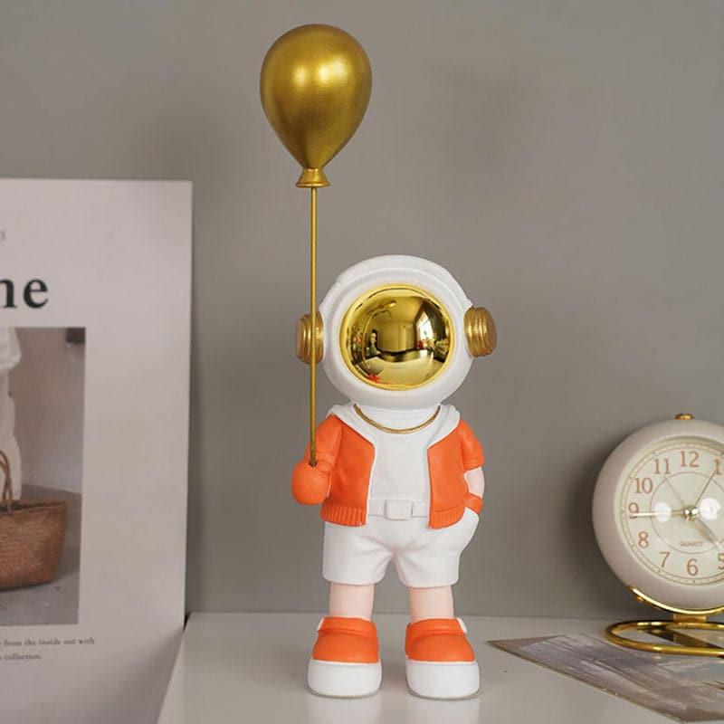 Buy Astronaut Kiddo Showpiece - Orange Showpieces from Vaaree