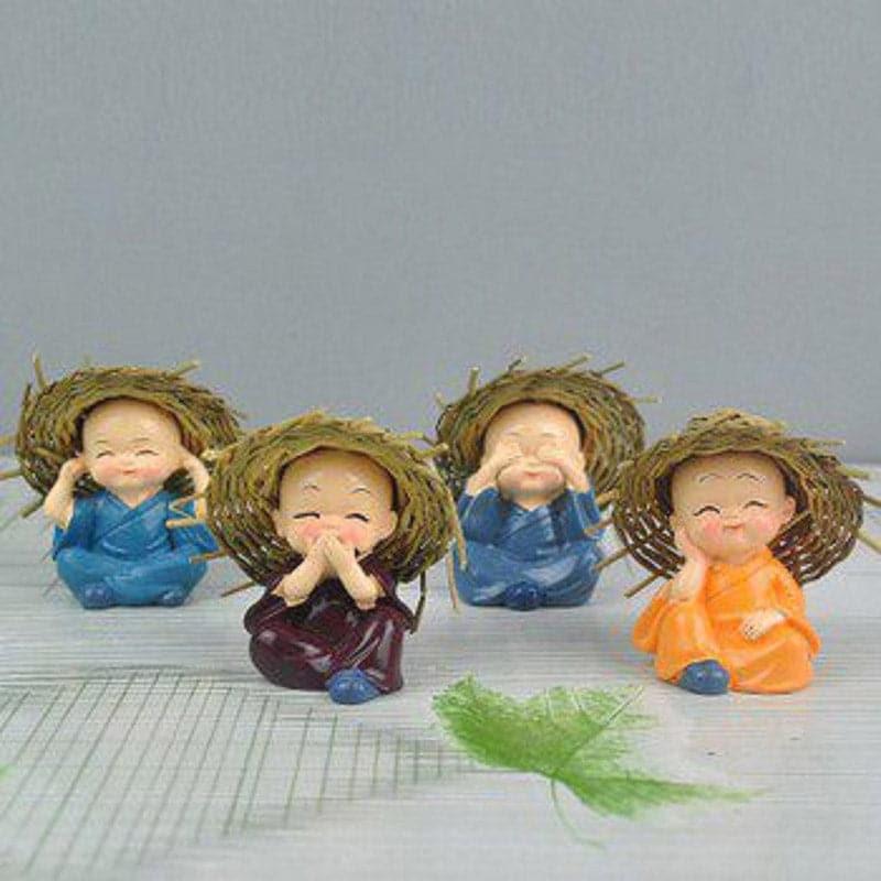 Buy Baby Monk Showpiece - Set Of Four Showpiece from Vaaree