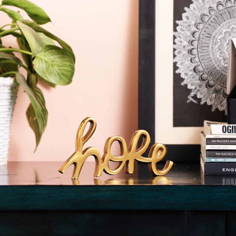 Buy Believe Bless Typography Showpiece - Gold Showpieces from Vaaree