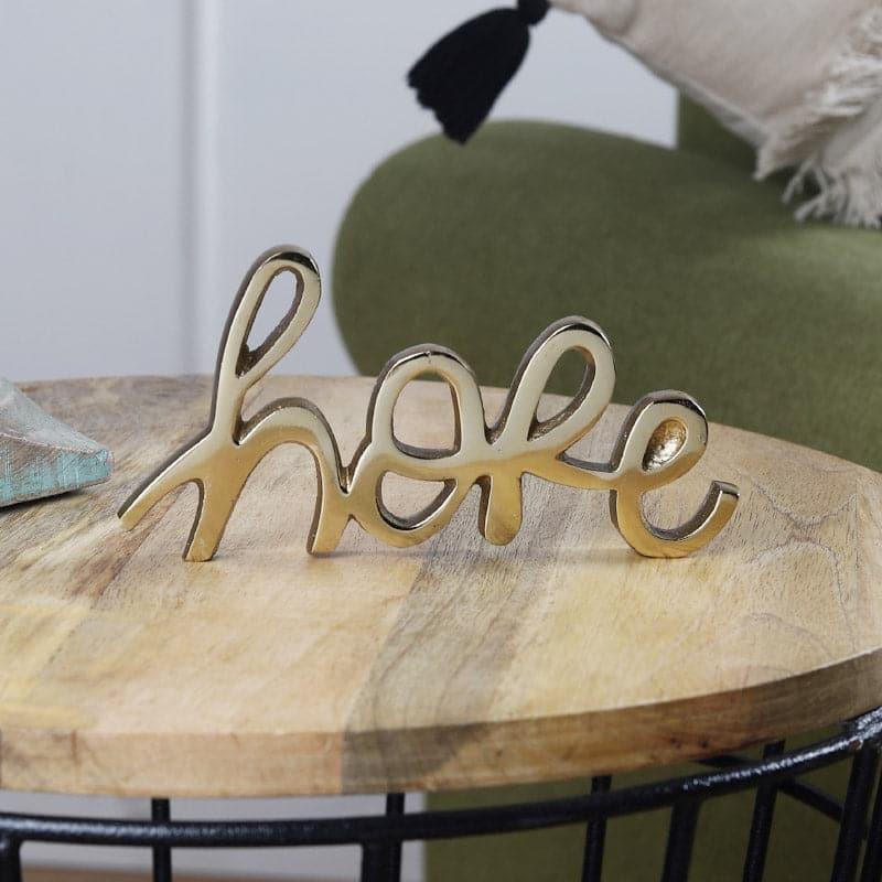 Buy Believe Bless Typography Showpiece - Gold Showpieces from Vaaree