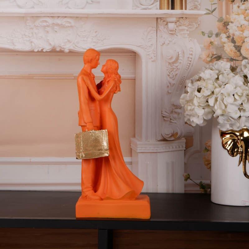 Buy It's The Moment Couple Showpiece - Orange Showpieces from Vaaree