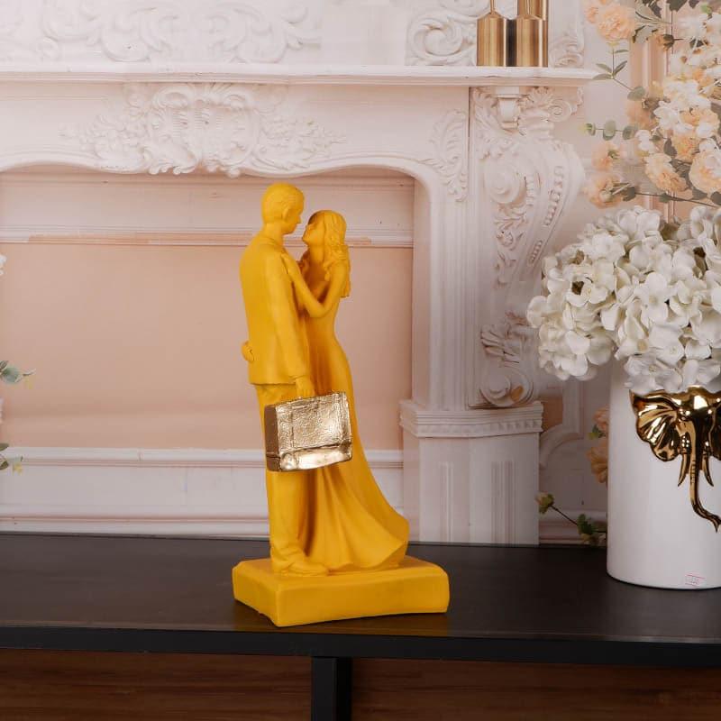 Buy It's The Moment Couple Showpiece - Yellow Showpieces from Vaaree