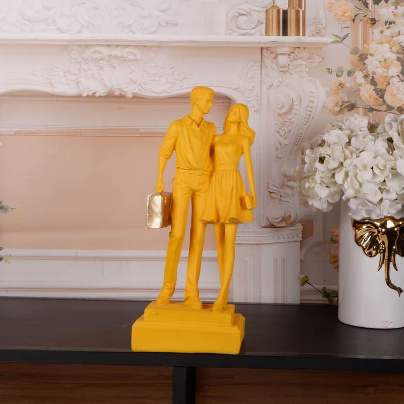 Buy Let's Go Shopping Couple Showpiece - Yellow Showpieces from Vaaree