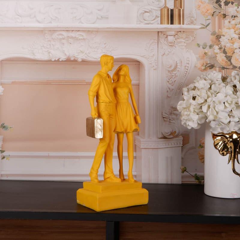 Buy Let's Go Shopping Couple Showpiece - Yellow Showpieces from Vaaree