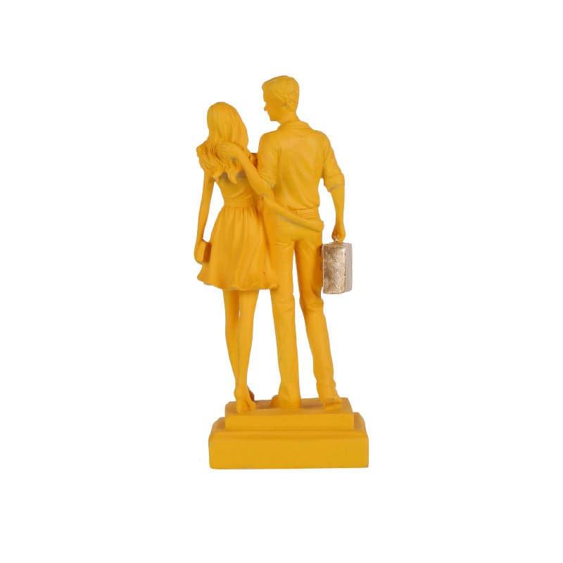 Buy Let's Go Shopping Couple Showpiece - Yellow Showpieces from Vaaree