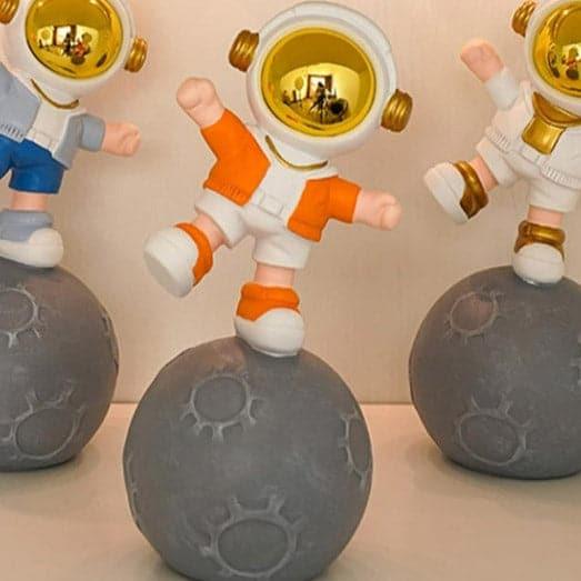 Buy Moon Land Astro Kid Showpiece - Orange Showpieces from Vaaree