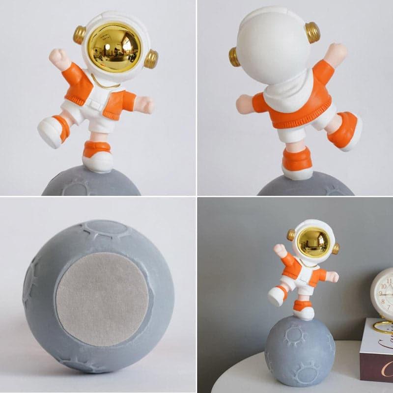 Buy Moon Land Astro Kid Showpiece - Orange Showpieces from Vaaree