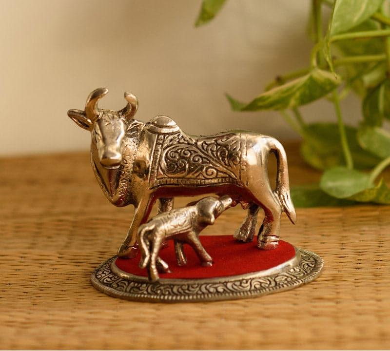 Buy Sacred Cow And Calf Showpiece Showpieces from Vaaree