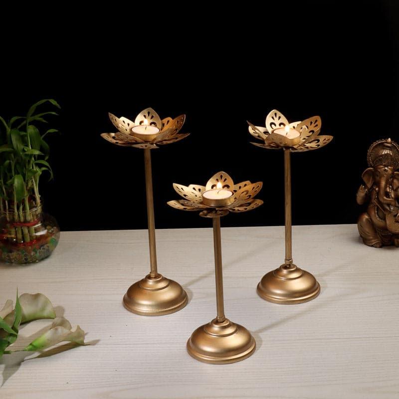 Buy Flora Flow Tealight Candle Holder - Set Of Three Candle Holders from Vaaree