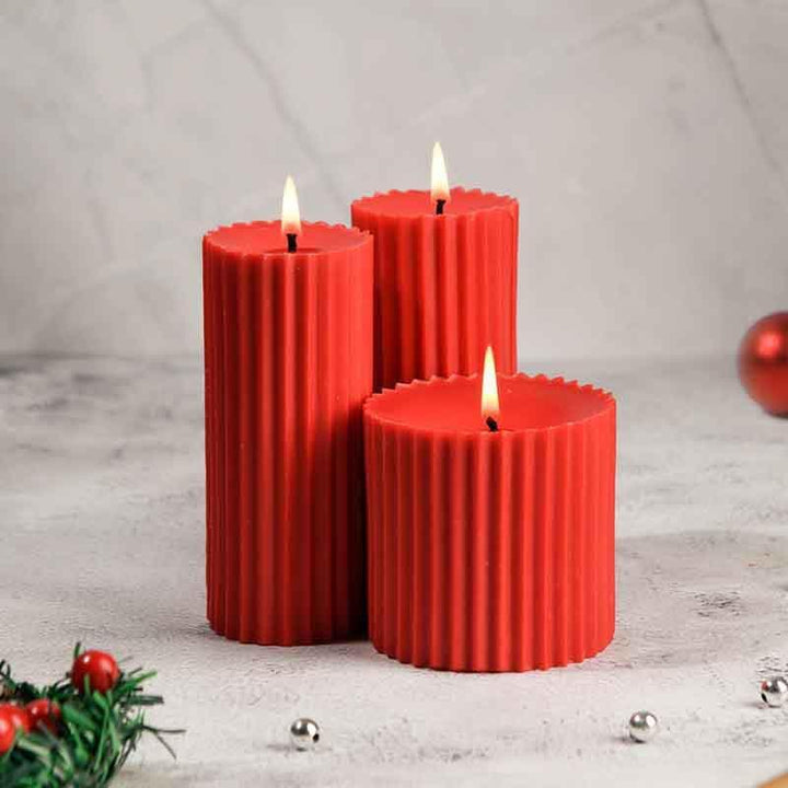Buy Red Christmas Trio Pillar Candle- Set Of Three at Vaaree online | Beautiful Candles to choose from